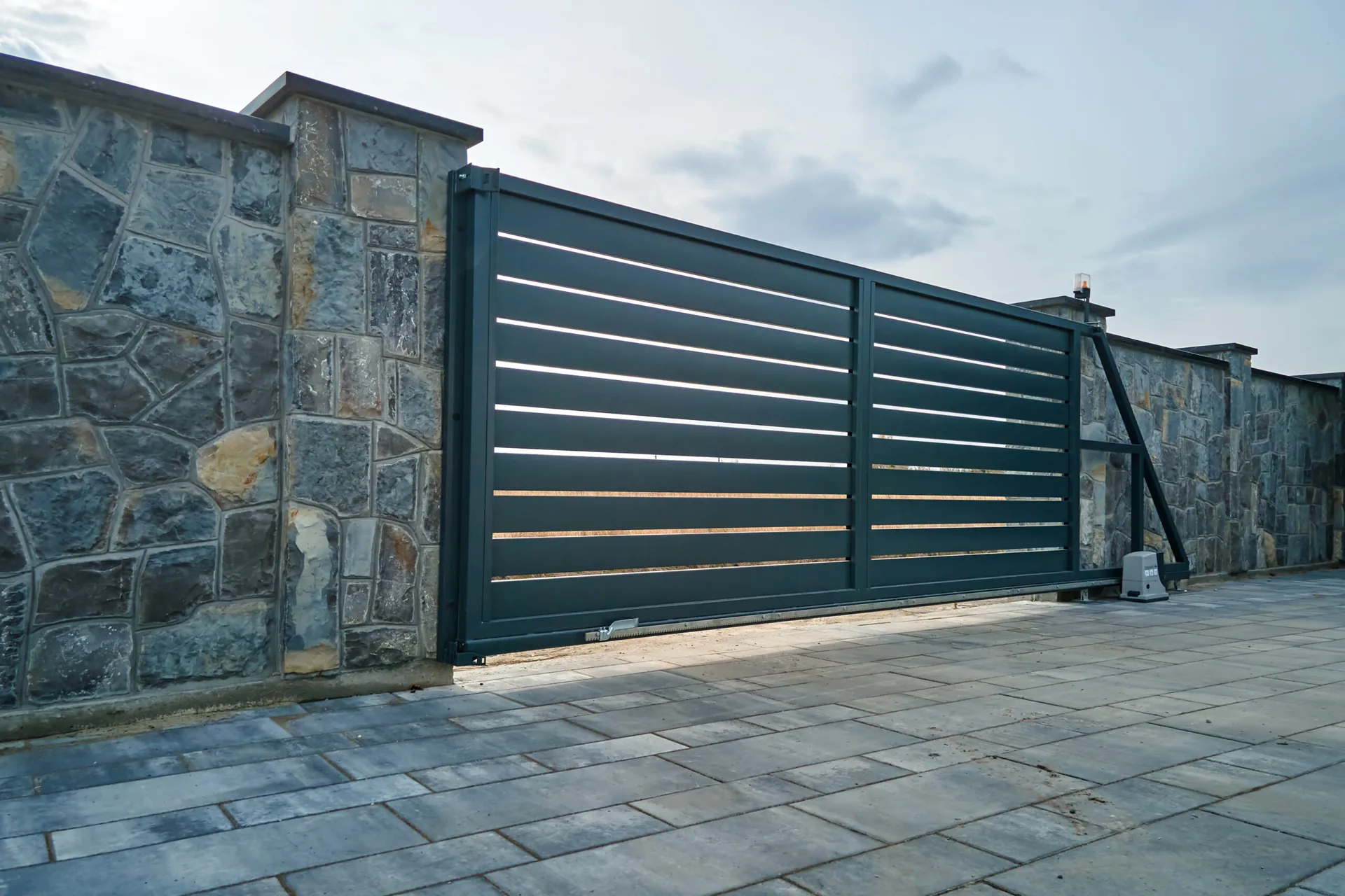 A sliding electric gate at a private property entrance