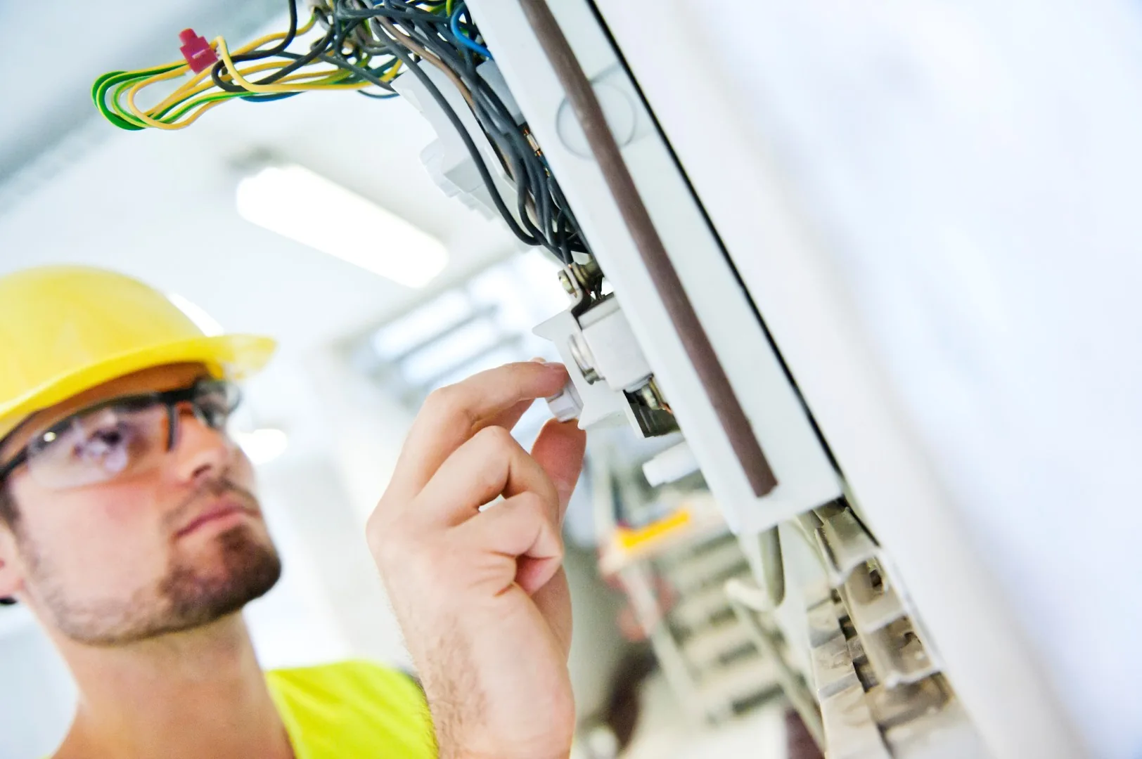 Engineer inspecting electrical security equipment